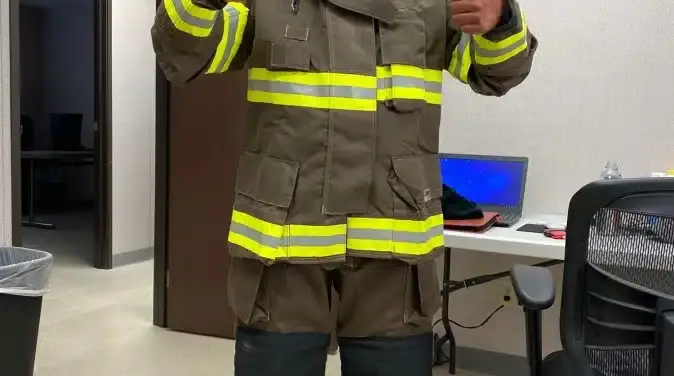 Ruben Escobedo, TES EH&S Manager, wearing bunker gear while escorting engineers during a heat and pressure wave study of the TPC fire and explosion.